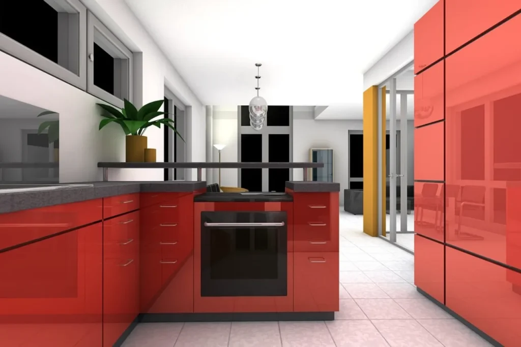 Modern kitchen with glossy red cabinets, white walls, and a black countertop. A potted plant sits atop the counter. Hanging light fixture and large windows add brightness. A glimpse of a living area with a yellow curtain is visible in the background.