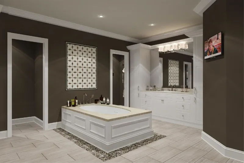 Modern bathroom with a central white bathtub, surrounded by brown walls and white trim. A vanity with a large mirror and lights is on the right. A small TV is mounted on the wall. Decorative tile pattern above the tub. Beige tiled floor.